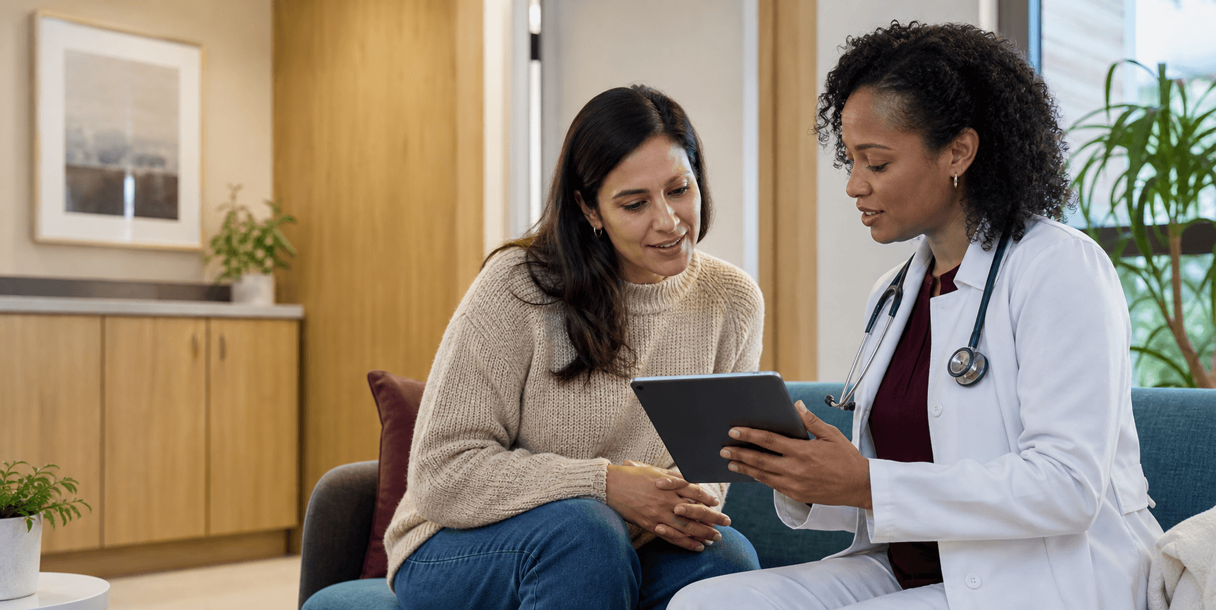 Black clinician reviewing care options with a patient